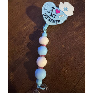I love my patients, tag holder baby blue, and white nurses hat, brand new